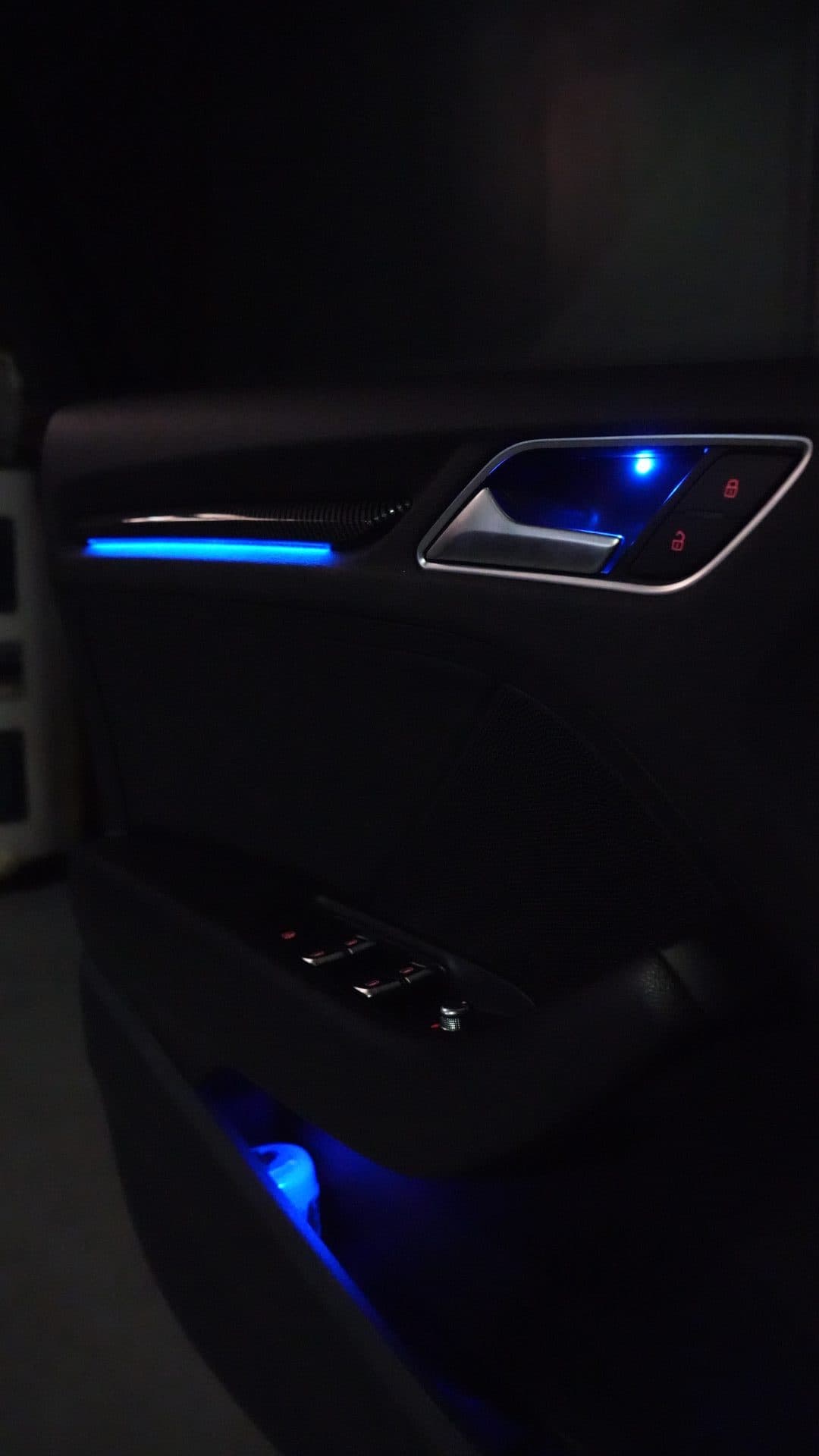 Audi — door handle ambient blue glow close-up
