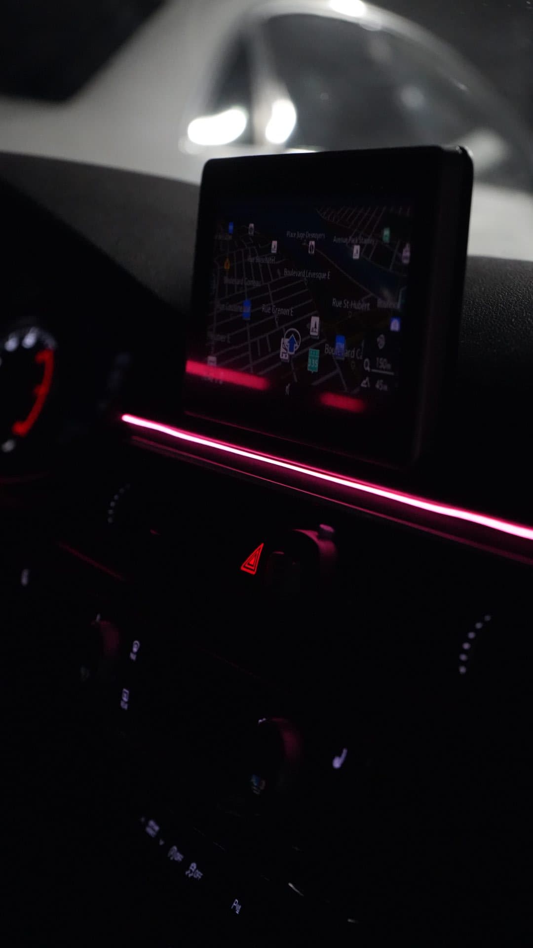 Audi — dashboard pink ambient strip at night