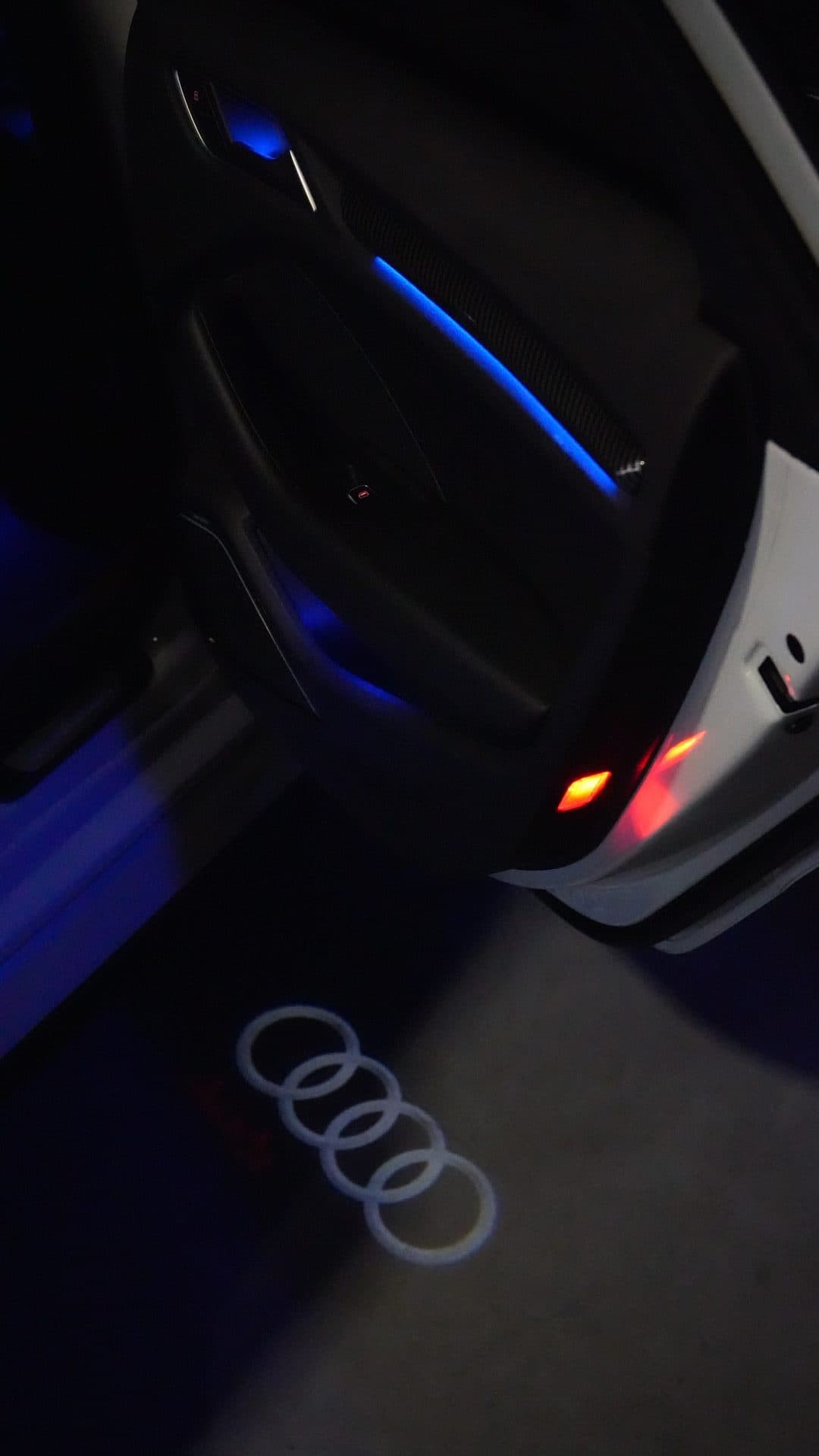 Audi S3 — four-ring logo projected on ground at night