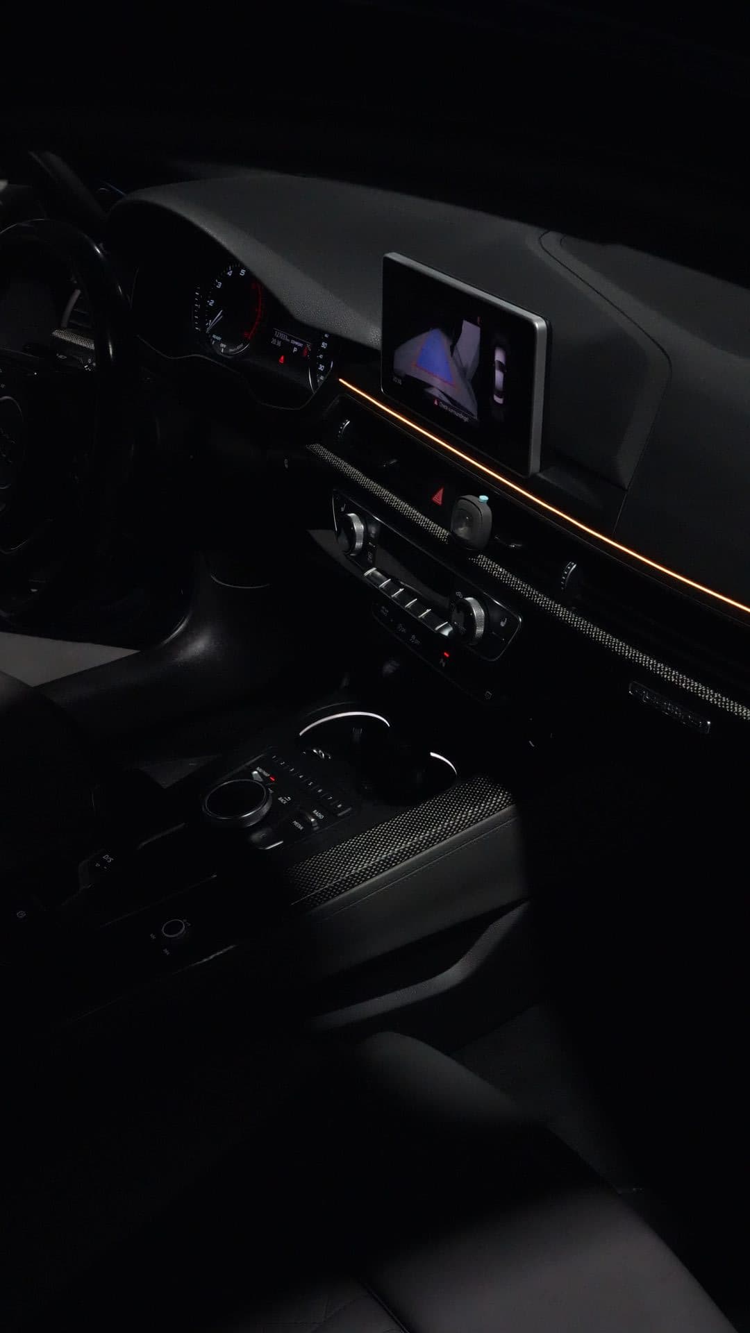 Audi S5 — center console with gold ambient strip