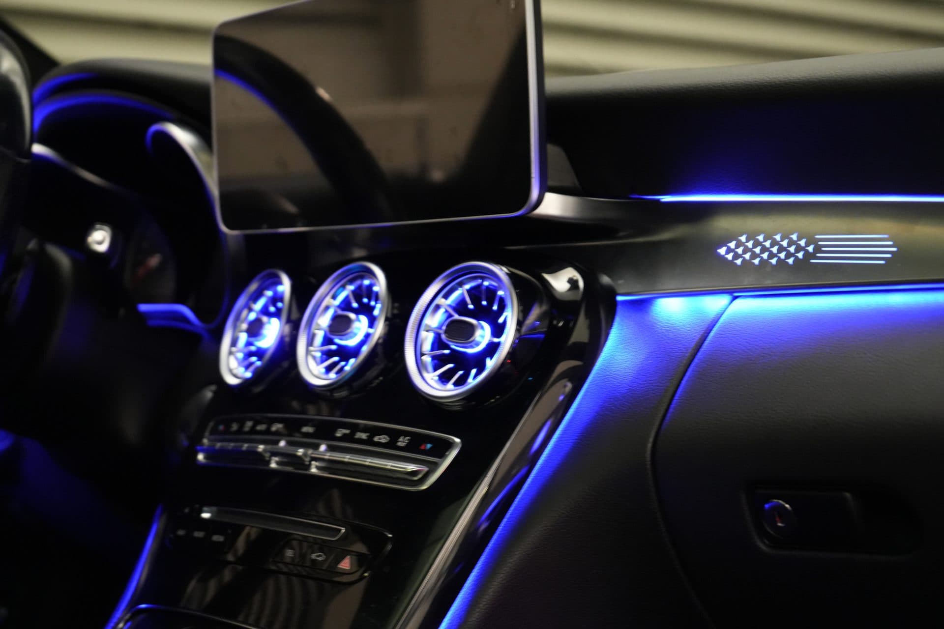 Mercedes C-Class — turbine vents and dash strip lit blue