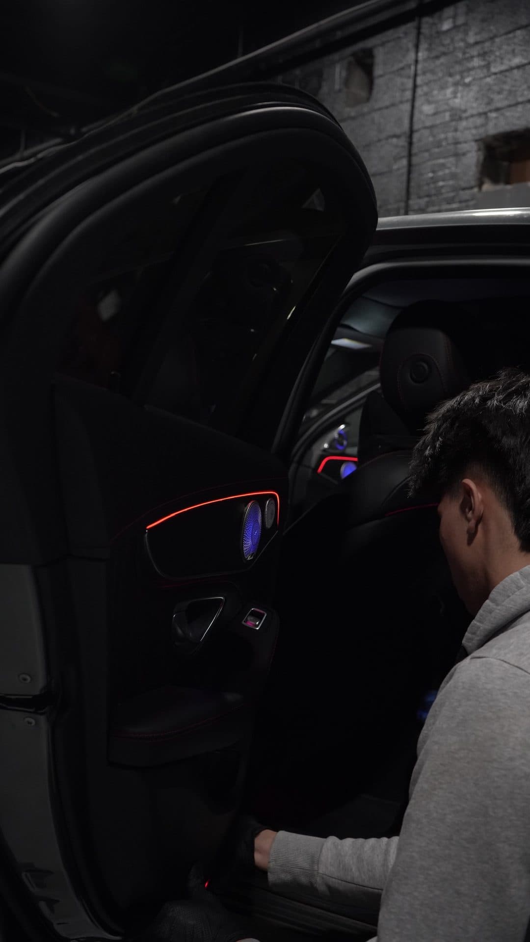 Mercedes — door open, red strip and blue speaker visible