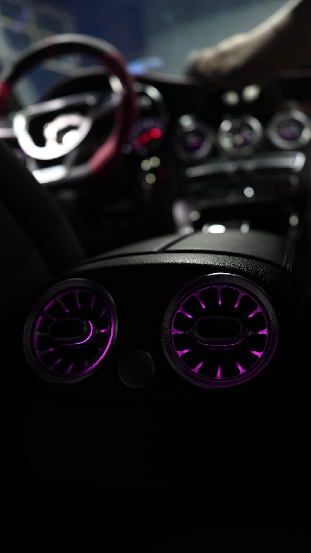 Mercedes — turbine vents glowing purple, passenger side